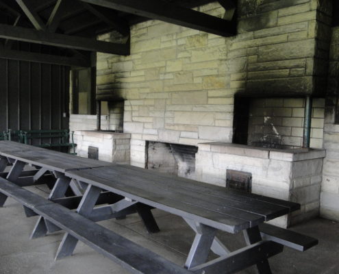 Picnic benches inside pavilion