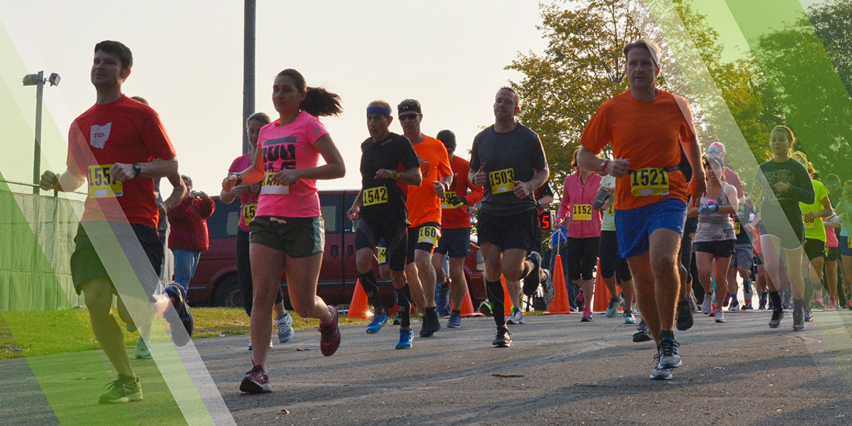 Road Races & Marathons Page Header depicting runners on a course through Mill Creek MetroParks